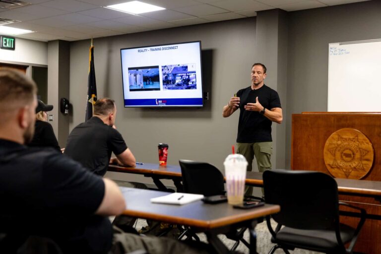 High Threat Training Group instructor teaching School Resource Officers active threat response data during NASRO SRO training
