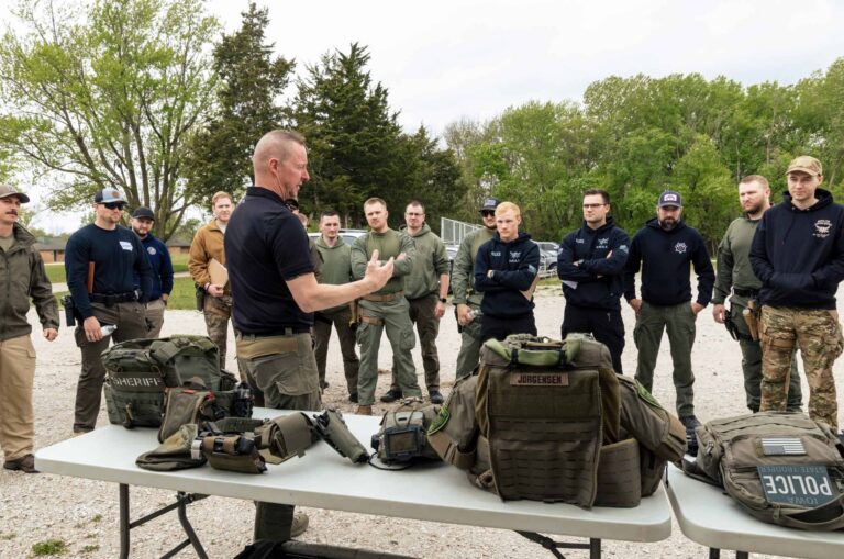 High Threat Training Group instructor teaching a small group of SWAT officers during tactical training.