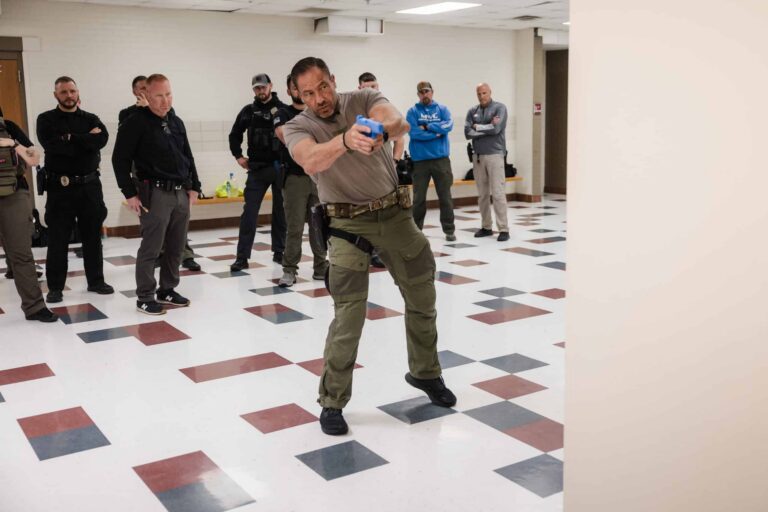 School resource officer learning corner clearing technique during NASRO STAR active shooter training course