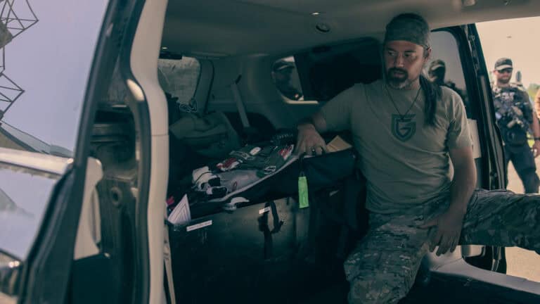 HTTG instructor demonstrates medical bag placement inside a MedVac vehicle during Vehicle Suppression training in Rochester, Minnesota.