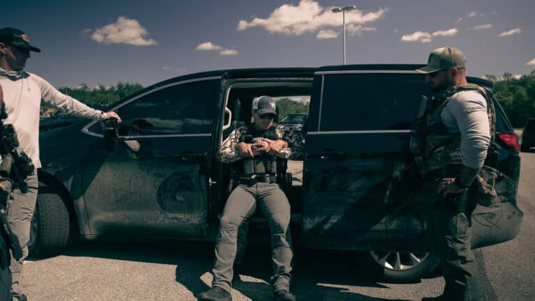 HTTG instructor demonstrates how to move an injured officer into a van through the side sliding door during vehicle suppression medical training.